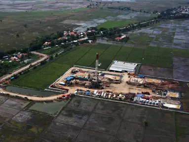 Foto udara sumur eksplorasi East Pondok Aren (EPN)-001 di WK PEP Tambun Field, Desa Sukawijaya, Tambelang, Kabupaten Bekasi, Jawa Barat, Kamis (28/12/2023). (merdeka.com/Imam Buhori)