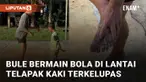 Seorang bule bermain bola bersama bocah di jalanan saat siang hari akhirnya telapak kakinya melepuh menarik perhatian