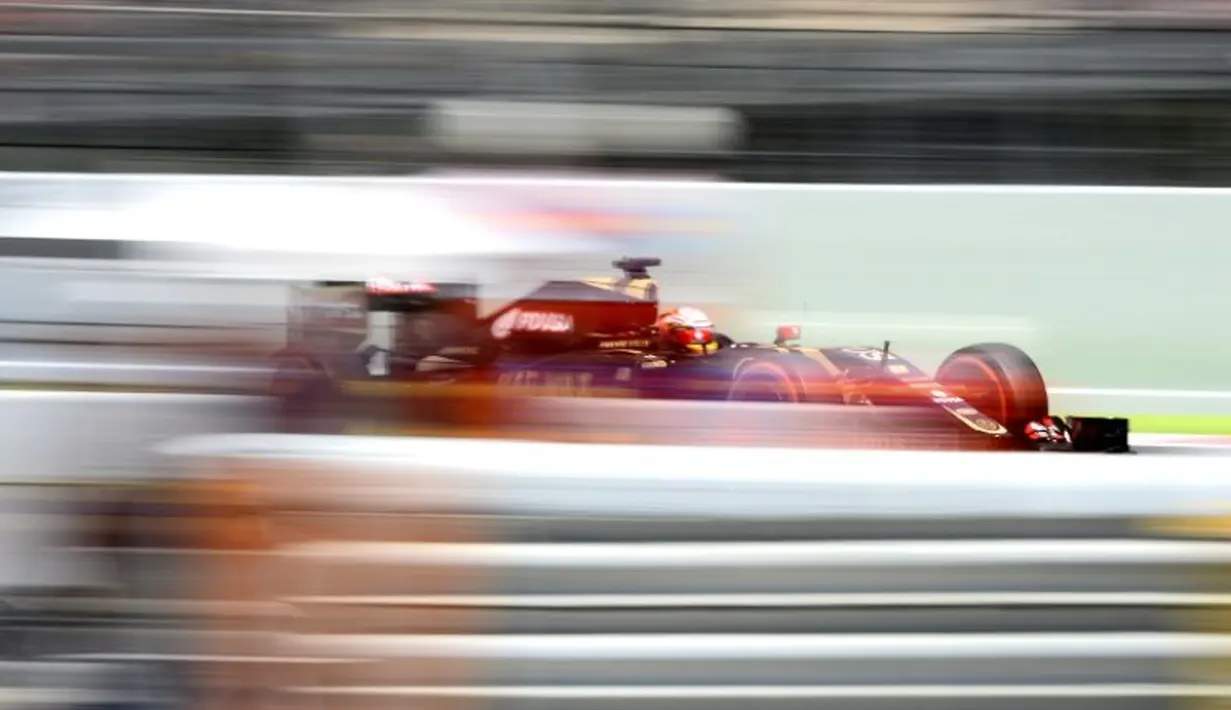 Aksi pebalap Lotus asal Perancis, Romain Grosjean. (AFP/JOSEP LAGO)