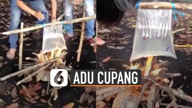 Beberapa pemuda sudah menyiapkan api yang menyala dan kantong plastik berisi air di atasnya.