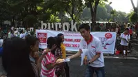 Gema Inti mendorong warga Surabaya, Jatim, menggunakan hak pilihnya. (Liputan6.com/Dian Kurniawan)