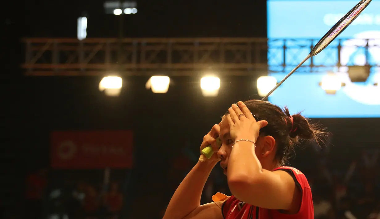 Greysia Polii berkonsentrasi penuh saat bertanding. (Bola.com/Arief Bagus)