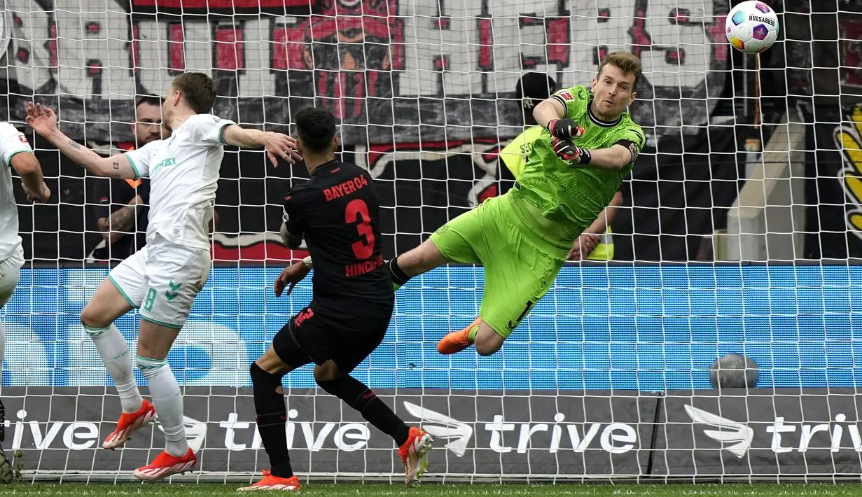 Bayer Leverkusen memastikan gelar juara Bundesliga 2023/2024 setelah mengalahkan Werder Bremen dengan skor telak 5-0. (AP Photo/Martin Meissner)