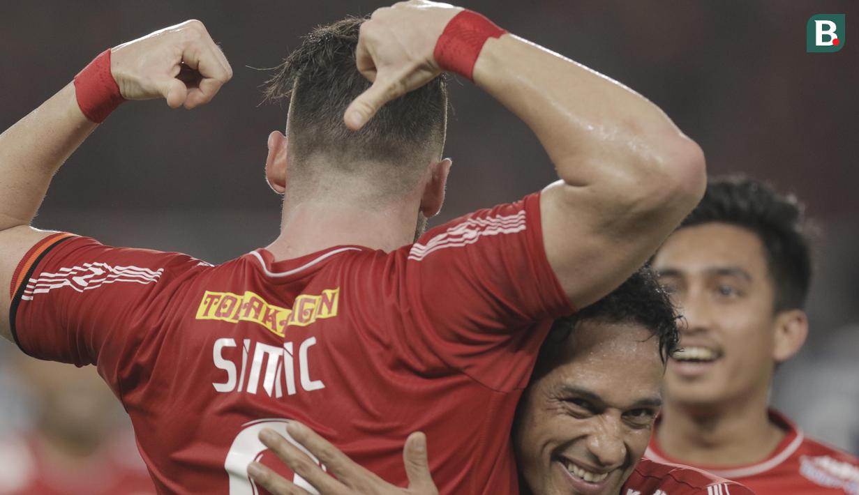 Striker Persija Jakarta, Marko Simic, melakukan selebrasi usai mencetak gol ke gawang Arema FC pada laga Liga 1 di SUGBK, Jakarta, Sabtu (31/3/2018). Babak pertama berakhir imbang 1-1. (Bola.com/M Iqbal Ichsan)