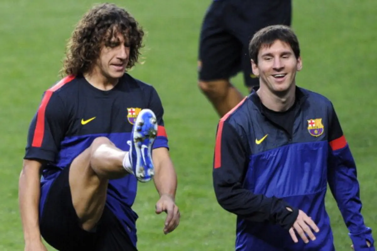 Carles Puyol dan Lionel Messi