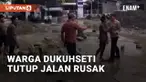 Warga Dukuhseti, Pati, lakukan aksi tutup jalan Alasdowo-Bakalan Kamis (09/01/2025). Penutupan dilakukan dengan batu besar dan ban bekas di depan Gedung Haji Alasdowo
