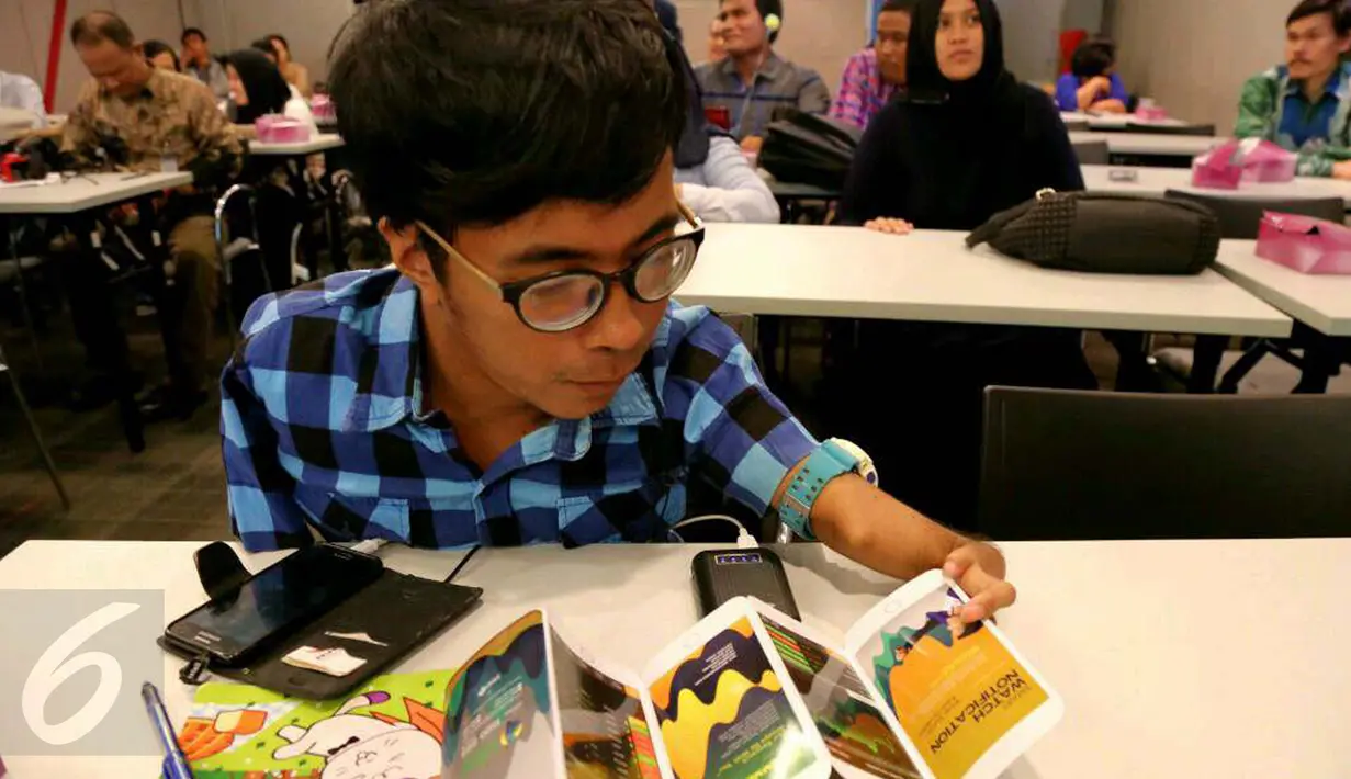 Seorang penyandang disabilitas saat mengikuti sekolah pasar modal yang diselenggarakan sebuah perusahaan sekuritas di Gedung Bursa Efek Indonesia, Jakarta, Rabu (18/1). (Liputan6.com/Angga Yuniar)