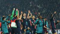 Para pemain Paris Saint-Germain (PSG) merayakan kemenangan mereka dalam pertandingan leg kedua semifinal Liga Champions UEFA antara Paris Saint-Germain (PSG) dan Arsenal di stadion Parc des Princes di Paris, pada 7 Mei 2025. (Thomas SAMSON/AFP)