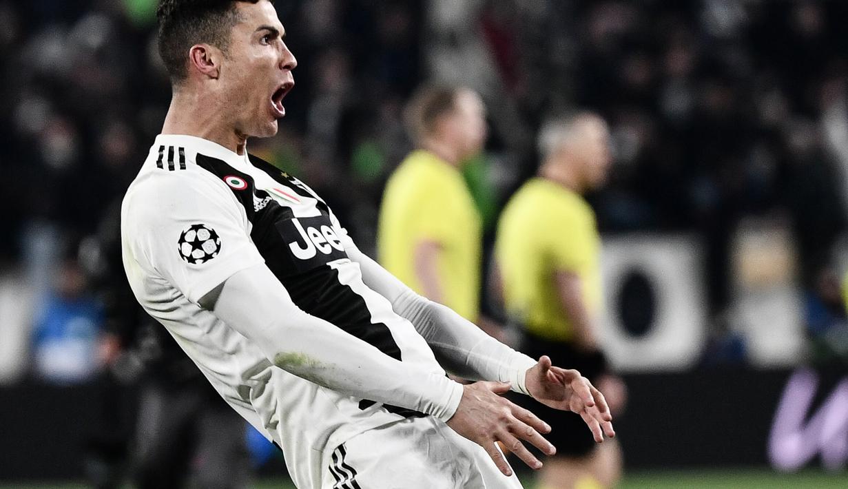 Selebrasi Cristiano Ronaldo pada laga kedua, babak 16 besar Liga Champions yang berlangsung di Stadion Allianz, Turin, Rabu (13/3). Juventus menang 3-0 atas Atl Madrid. (AFP/Filippo Monteforte)