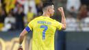 <p>Selebrasi Striker Al Nassr, Cristiano Ronaldo setelah mencetak gol kedua timnya ke gawang Damac melalui tendangan bebas pada laga pekan ke-10 Liga Arab Saudi 2023/2024 yang berlangsung di King Saud University Stadium, Riyadh, Sabtu (21/10/2023) malam WIB. (AFP/Fayez Nureldine)</p>