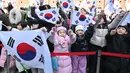 Gerakan 1 Maret masih dirayakan setiap tahunnya, warga Korea Selatan tumpah ruah ke jalan sambil mengibarkan bendera. (Jung Yeon-je/AFP)