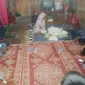 Korban tenggelam setelah dievakuasi oleh masyarakat di Kabupaten Kampar. (Liputan6.com/M Syukur)