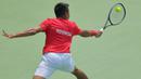 Petenis Indonesia, M. Rifqy Fitriadi, berusaha mengembalikan bola saat melawan petenis Selandia Baru, Ajeet Rai, pada laga Piala Davis 2019 Grup II Zona Asia/Oceania di Stadion Tenis GBK, Jakarta, Sabtu (14/9). Rifqi kalah 6-7, 3-6 dari Ajeet. (Bola.com/Peksi Cahyo)