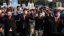 Sejumlah relawan Prabowo Subianto-Gibran Rakabuming Raka menggelar aksi damai capaian pemerintahan Presiden Joko Widodo-Ma'ruf Amin di kawasan Patung Kuda, Jakarta Pusat, Jumat (18/10/2024). (Liputan6.com/Angga Yuniar)
