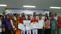 Peraih emas Asian Games 2018 Defia Rosmaniar mendapat sambutan di Sekolah Tinggi Ilmu Ekonomi Kesatuan Bogor, Selasa (4/9/2018). (Liputan6.com/Achmad Sudarno