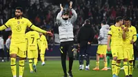 Manajer Chelsea Thomas Tuchel merayakan kemenangan 2-1 atas Lille pada leg kedua babak 16 besar Liga Champions di Stadion Pierre Mauroy. Kamis (17/3/2022) dini hari WIB. (FRANCK FIFE / AFP)