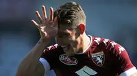 Penyerang Torino, Andrea Belotti, merayakan gol yang dicetaknya ke gawang AS Roma pada laga Serie A di Stadion Grande Torino, Turin, Minggu (25/9/2016). (AFP/Marco Bertorello)