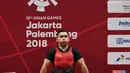 Atlet angkat besi Indonesia Eko Yuli Irawan berhasil memenangkan pertandingan Angkat Besi pada Asian Games 2018 di JIexpo, Kemayoran,Jakarta, Selasa (21/8). (merdeka.com/Imam Buhori)