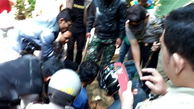 Pelaku berhasil ditangkap kepolisian. (Foto: Liputan6.com/SRU RAPI BNA/Muhamad Ridlo)