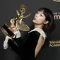 Aktris Korea Selatan Lee Yoo-mi memenangkan gelar Aktris Tamu Luar Biasa dalam Serial Drama untuk perannya di Squid Games di hari kedua Creative Arts Emmy Awards yang digelar di Microsoft Theater di Los Angeles, AS, 4 September 2022. (Michael Tran / AFP)