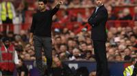 Manajer Arsenal Mikel Arteta dan Manajer Manchester United (MU) Erik ten Hag.&nbsp;(Oli SCARFF / AFP)