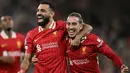Pemain Liverpool Mohamed Salah (kiri) bersama Kostas Tsimikas merayakan gol pada laga matchday 2 League Phase Liga Champions 2024/2025 melawan Bologna di Anfield Stadium, Inggris pada Rabu 2 Oktober 2024 atau Kamis (3/10/2024) dini hari WIB. (Paul ELLIS/AFP)