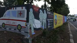 Mural bertemakan COVID-19 menghiasi dinding di kawasan Manggarai, Bukit Duri, Jakarta, Jumat (28/8/2020). Mural tersebut dibuat untuk meningkatkan kepatuhan masyarakat akan protokol kesehatan karena kasus COVID-19 nasional terus meningkat. (merdeka.com/Imam Buhori)