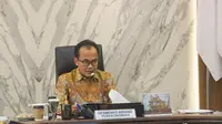 Sekretaris Kemenko Perekonomian Susiwijono Moegiarso dalam kegiatan Sosialisasi NK Implementasi dan Penyusunan Tahun 2022 yang diselenggarakan secara hybrid di Kantor Kementerian Koordinator Bidang Perekonomian, Senin (19/9/2022). (sumber: ekon.go.id)