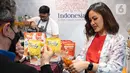 Mitra usaha kuliner GoTo melayani tamu undangan dalam Paviliun Indonesia di Davos, Swiss (26/05/2022). Partisipasi GoTo dalam Paviliun Indonesia, merupakan aksi nyata GoTo untuk mendukung pemerintah Indonesia dalam mendorong transformasi ekonomi berbasis digital yang menjadi salah satu agenda utama dalam Presidensi G20 Indonesia 2022. (Liputan6.com/HO/GoTo)