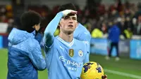 Gelandang serang Manchester City, Phil Foden mencatat hattrick ke gawang Brentford pada pekan ke-23 Liga Inggris 2023/2024, Selasa (6/2/2024) dini hari WIB. (BEN STANSALL / AFP)