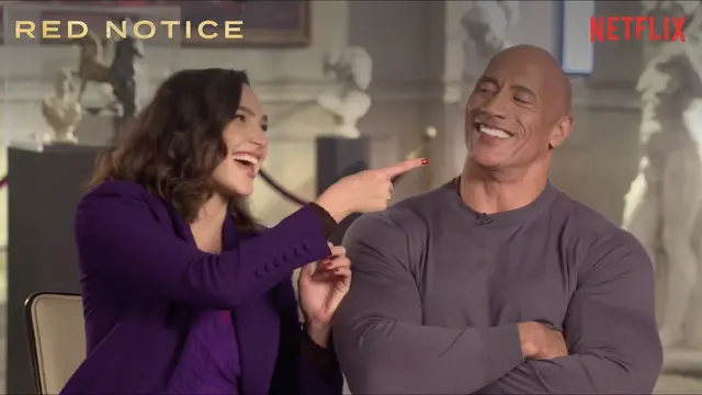 Gal Gadot dan Dwayne Johnson, dalam konferensi pers daring Red Notice. (Netflix)
