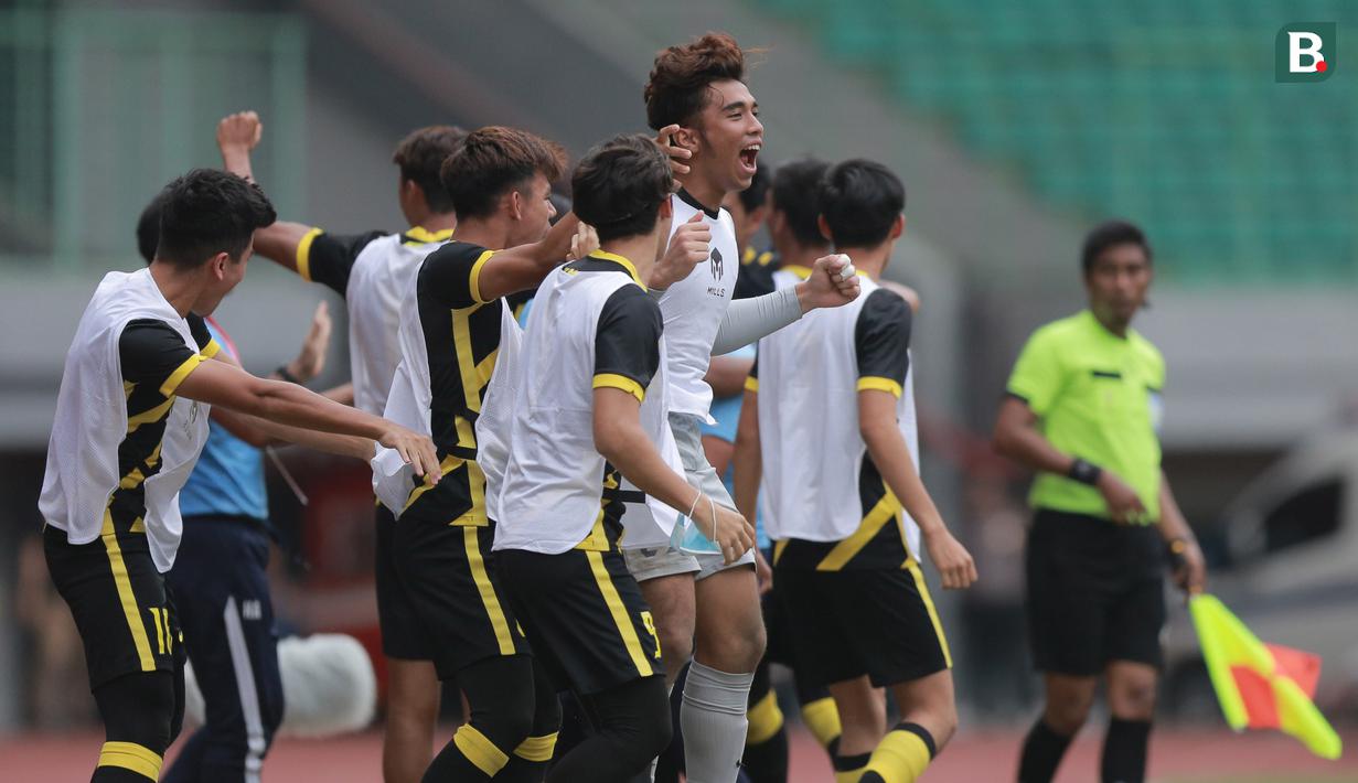 <p>Pemain cadangan Timnas Malaysia U-19 merayakan gol ke gawang Timnas Vietnam U-19 pada laga semifinal Piala AFF U-19 2022 di Stadion Patriot Candrabhaga, Bekasi, Rabu (13/7/2022). (Bola.com/M Iqbal Ichsan)</p>