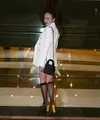 Wulan Guritno tampil mengenakan oversized blazer putih dengan mini skirt cokelat-kuning. Ia terlihat membawa Ultra Small Lady Dior My ABCDior Bag (Black Ultramatte Cannage Calfskin) yang harganya diperkirakan sekitar Rp66,1 jutaan. Foto: Instagram.