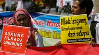 Massa yang terdiri dari elemen mahasiswa, musisi dan organisasi non profit ini menyatakan sikap tegas menolak pemilihan kepala daerah melalui DPRD, Jakarta, (24/9/14). (Liputan6.com/Faizal Fanani)