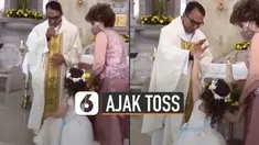 Momen lucu bocah polos terekam di sebuah gereja saat hendak diberkati.