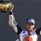 Marc Marquez saat berada di podium usai balapan celebrates on the podium  MotoGP Valencia di Ricardo Tormo Circuit, Cheste, (12/11/2017). Gelar tersebut merupakan yang keempat buat Marquez.  (AFP/Pierre-philippe Marcou)