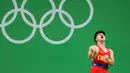 Ekspresi Lifter Tiongkok, Long Qingquan usai mengangkat beban pada cabang angkat besi putra selama Olimpiade Rio 2016, Minggu (7/8). Long memecahkan rekor dunia kelas 56 kg milik atlet Turki Halil Mutlu di Olimpiade Sydney 2000 lalu (REUTERS/Stoyan Nenov)