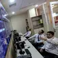 Layar monitor yang menunjukan data dwelling time di kantor pengelola portal INSW, Jakarta, Senin (6/2). Dengan adanya INSW semua tercatat dan termonitor secara online dan memudahkan pelaku usaha dibidang kegiatan ekspor impor. (Liputan6.com/Faizal Fanani)