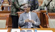 Menteri Koordinator Bidang Politik Hukum dan Keamanan (Menko Polhukam) Mahfud MD bersiap untuk mengikuti Rapat Dengar Pendapat (RDP) dengan Komisi III DPR RI di Gedung Parlemen, Jakarta, Rabu (15/2/2023). Rapat membahas penjelasan DPR terhadap RUU Perubahan tentang Mahkamah Konstitusi (MK). (Liputan6.com/Faizal Fanani)