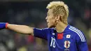Gaya striker Jepang Keisuke Honda di laga penyisihan Grup E PD 2010 melawan Denmark di Royal Bafokeng Stadium, Rustenburg, 24 Juni 2010. Jepang unggul 3-1. AFP PHOTO / GABRIEL BOUYS 