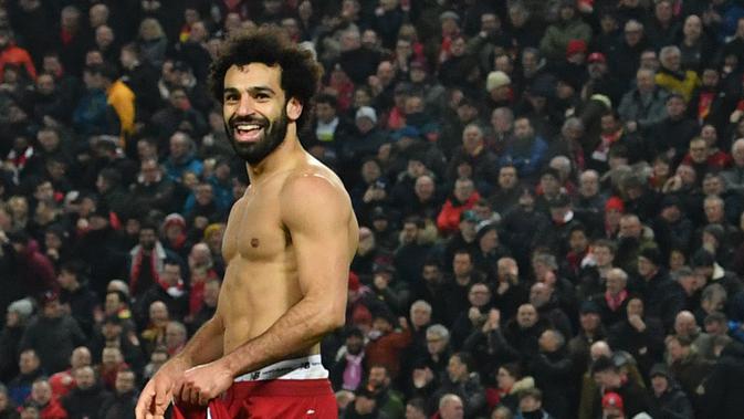 Striker Liverpool, Mohamed Salah merayakan golnya ke gawang MU. Liverpool menang 2-0, Minggu (19/1/2020) WIB (PAUL ELLIS / AFP)