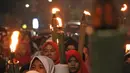 Anak-anak mengikuti pawai obor di kawasan Mampang Prapatan, Jakarta, Sabtu (12/5). Pawai obor berkeliling dari Pejatan sampai Warung Buncit menyambut Ramadan 1439 H. (Liputan6.com/Herman Zakharia)