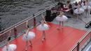 Anggota Staatsballett Berlin menari di atas kapal pesiar selama tur melalui pusat kota di Berlin, Jerman, Kamis (10/6/2021). Pertunjukan itu diikuti oleh banyak orang di sepanjang rute. (Paul Zinken/dpa via AP)