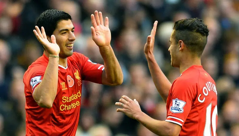 Luis Suarez dan Philippe Coutinho ketika membela Liverpool. (AFP/Paul Ellis)