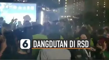 Beredar video acara dangdutan yang digelar di Rumah Sakit Darurat Wisma Atlet. Terlihat kerumunan yang sedang berjoget dan menikmati musik dangdut.