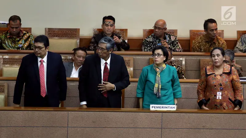 Menteri Keuangan Sri Mulyani menerangkan, syarat untuk turut serta AEoI ialah memiliki legislasi primer setara undang-undang.