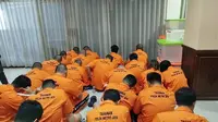 Polda Metro Jaya menetapkan 24 orang tersangka kasus dugaan judi online yang turut melibatkan sejumlah pegawai Kementerian Komdigi. (Liputan6.com/Ady Anugrahadi)
