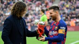 Carles Puyol. Kapten Barcelona ini adalah sama-sama lulusan La Masia yang mulai bermain bersama di tim senior pada 2004. Hingga Puyol pensiun pad 2014, kolaborasi keduanya telah menghasilkan 18 trofi untuk Barcelona. (Foto: AFP/Lluis Gene)