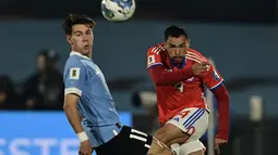 Uruguay berhasil mengalahkan Chile dengan skor 3-1. (Photo by Pablo PORCIUNCULA / AFP)