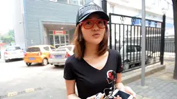 Selain menjalani bisnis judi ilegal, wanita 23 tahun itu mengaku meraup banyak uang karena bekerja sebagai wanita panggilan. (CHINA OUT AFP PHOTO)